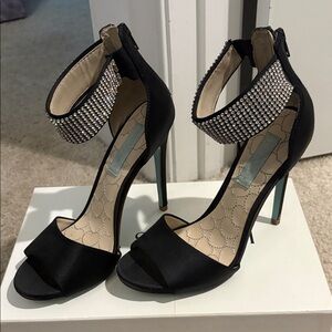 Blue by Betsy Johnson SN Unite with a rhinestone strap and a blue bottom.